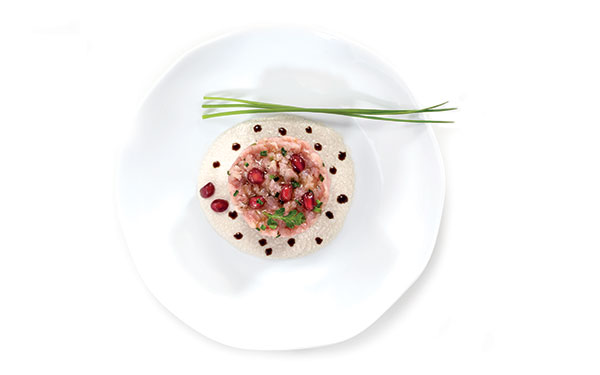 Veal tartare with Olitalia “I Dedicati” Special Extra Virgin Olive Oil for Meat, aromatic herbs, pomegranate seeds and Caesar sauce 1